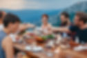 Group of friends having dinner outdoors