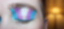 Person closing their eyes, displaying trans flag eye shadow